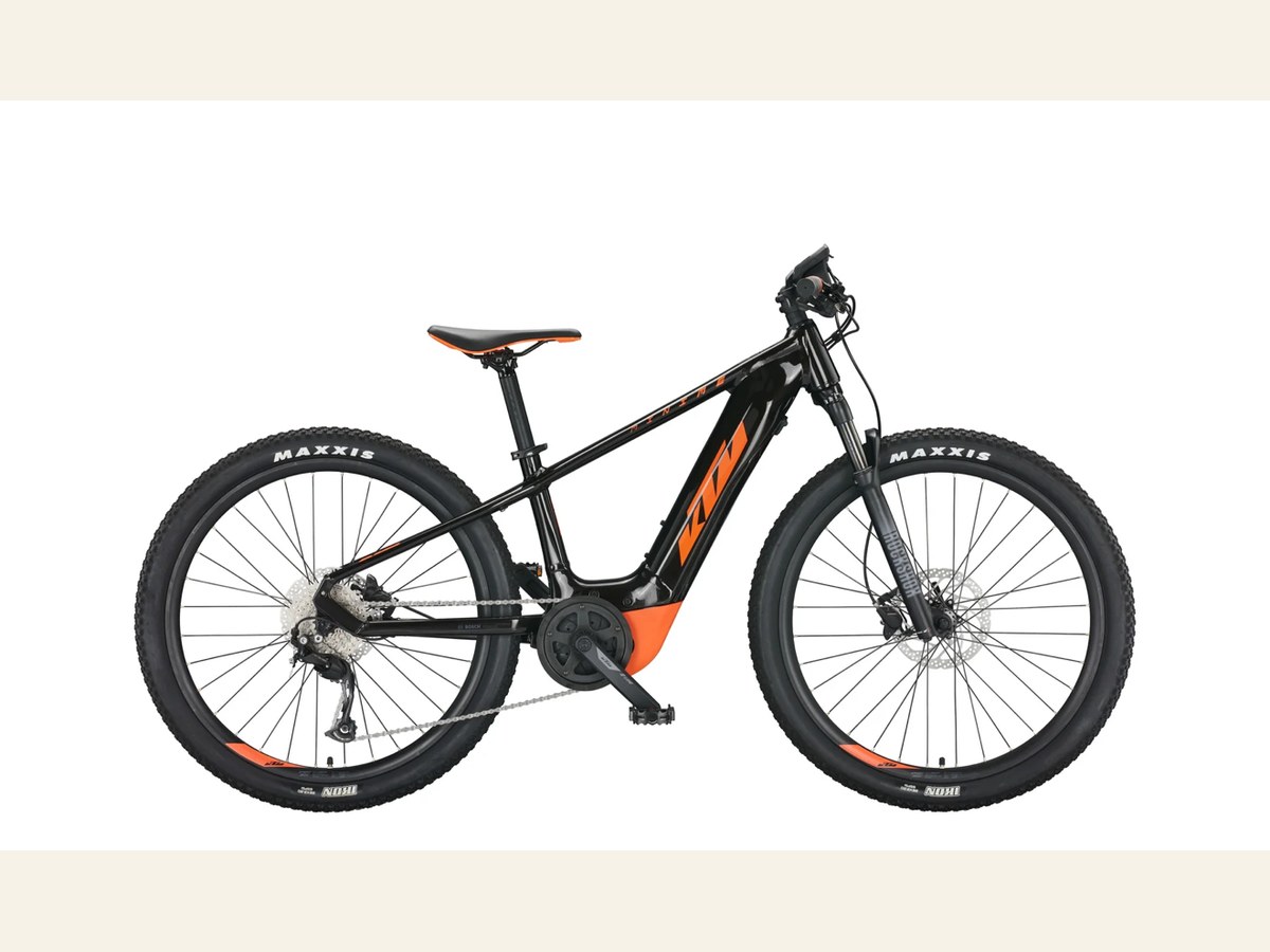 Black and orange KTM electric mountain bike for children, 26-inch category